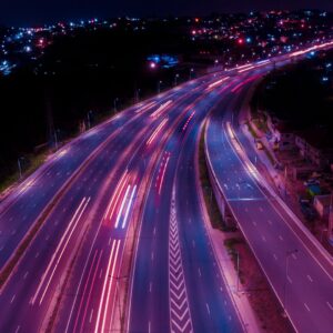 A highway at night with a purple glow