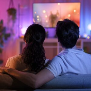 Two people watching television